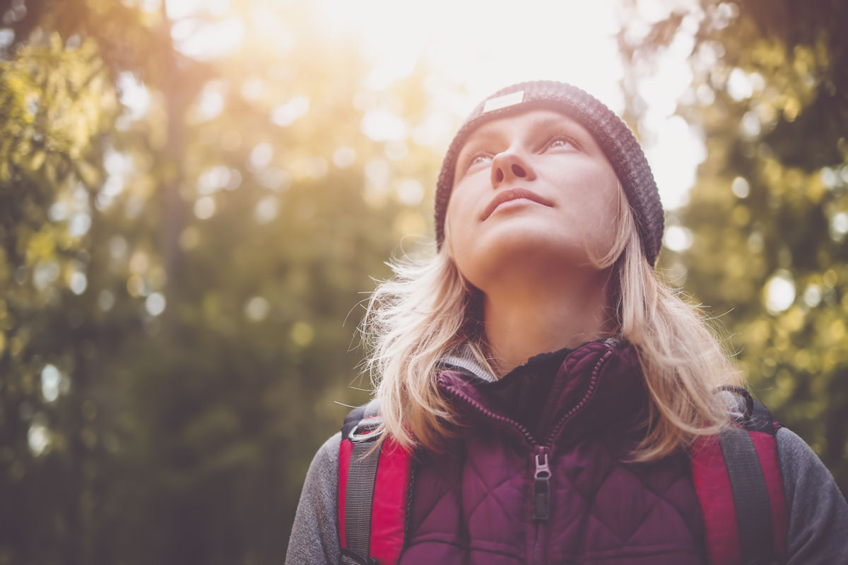 Woman hiking in woods for anxiety treatment in Pennsylvania