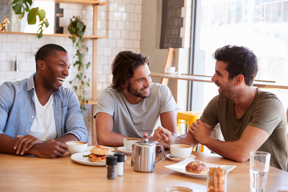 meth-addiction-recovery Three men enjoying breakfast at meth addiction center