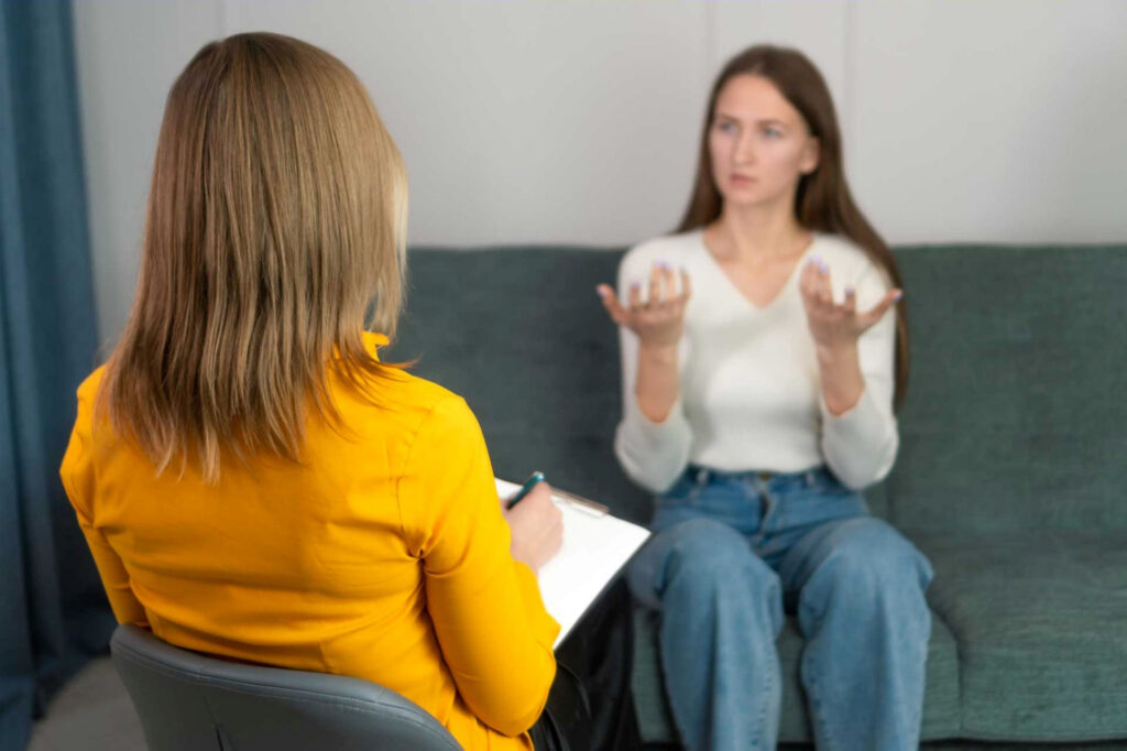 Woman explaining street drug use to therapist