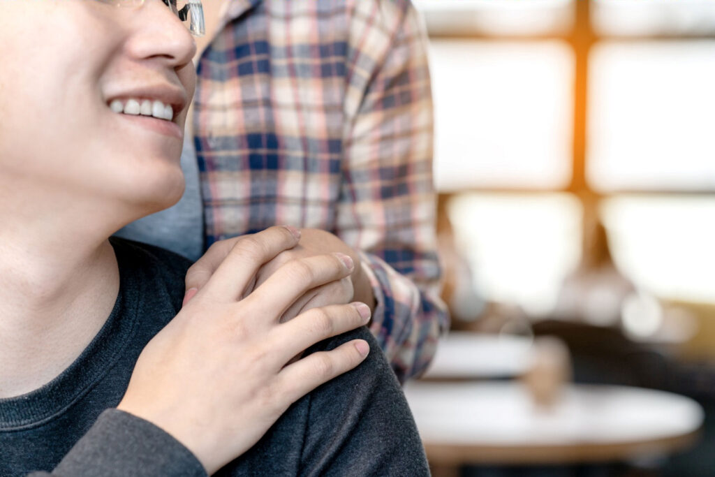 Parent holding hand of someone in recovery to fentanyl addiction