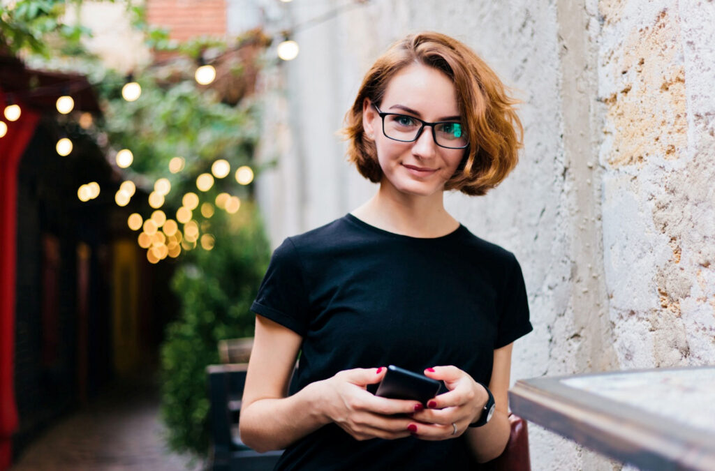 hipster woman looking up from researching 7-Oh and kratom